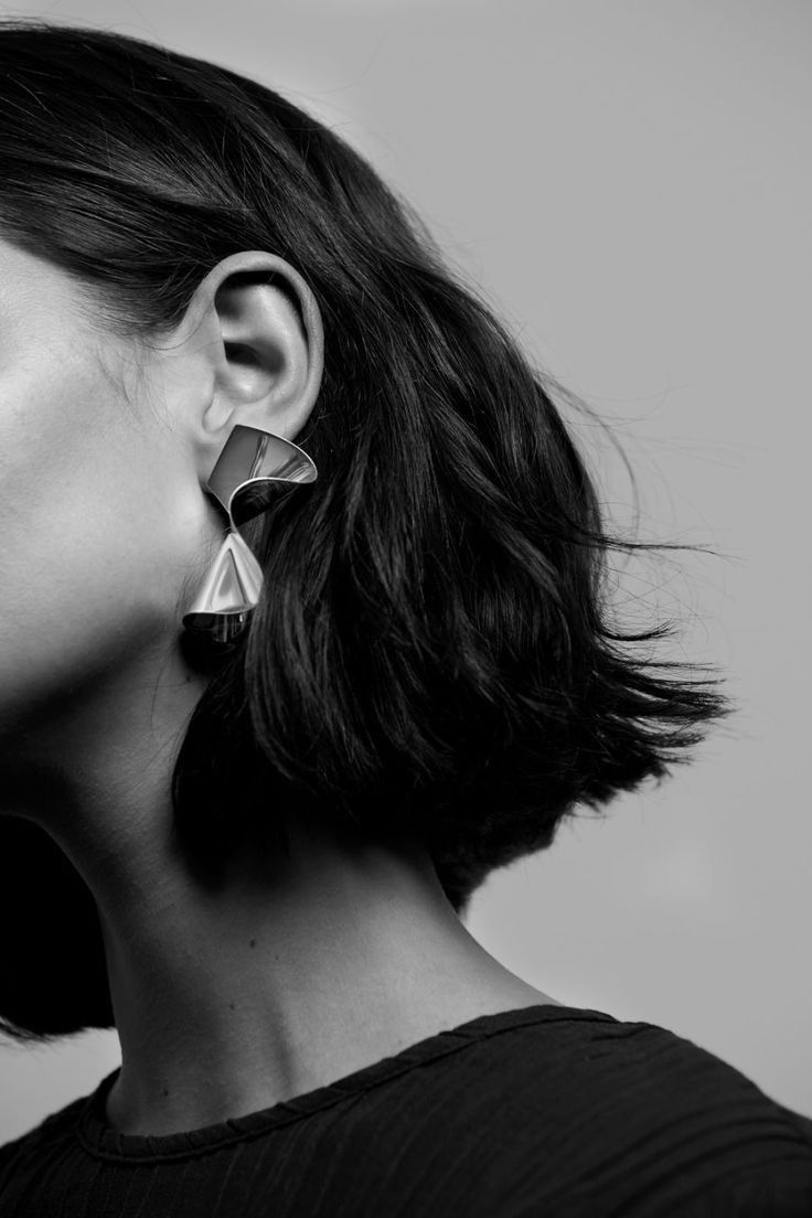 Sleek dark bob in profile, studio portrait